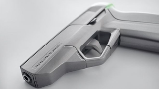 Illustration for article titled Will This Watch-Controlled Smart Pistol Really Make Owning a Gun Safer?